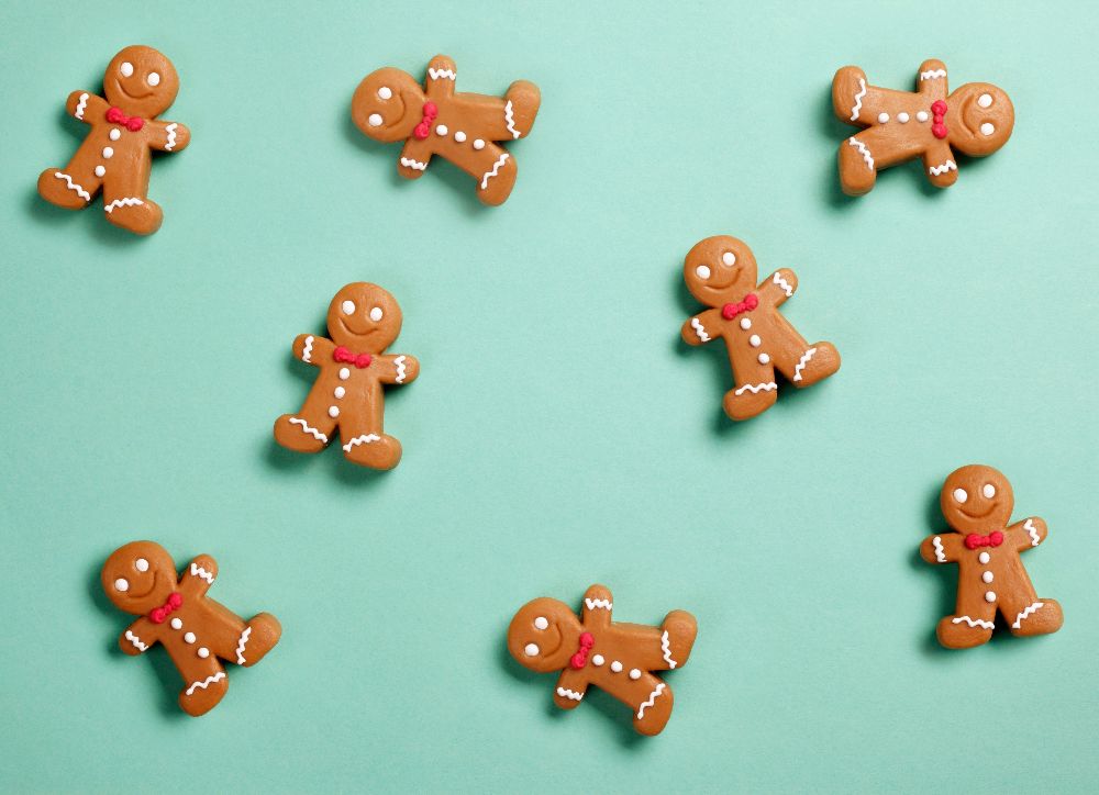 gingerbread men for christmas against a green background