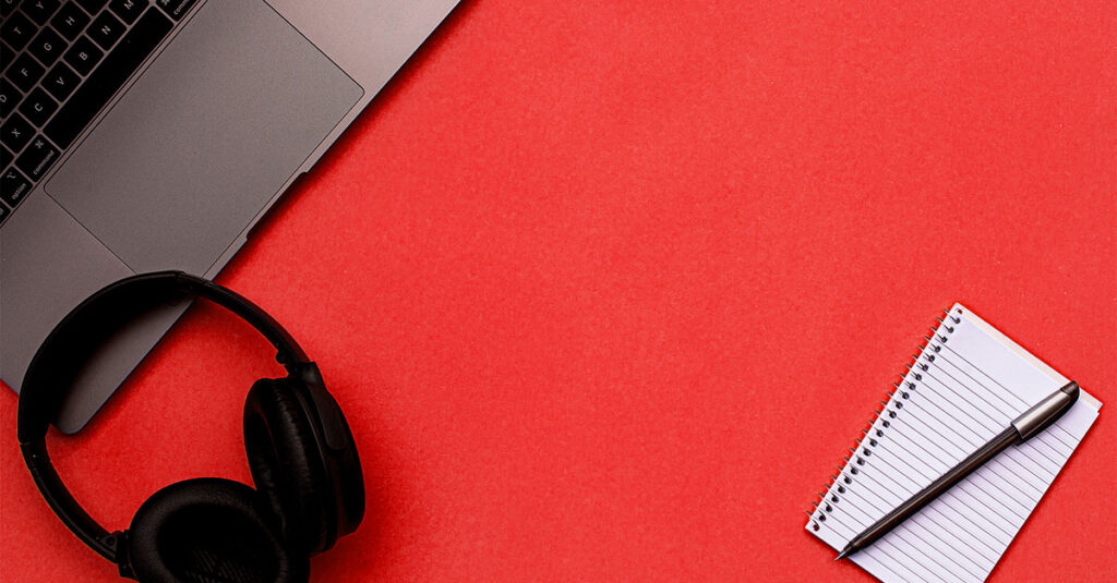 Photo collage of a laptop, headphones and notepad
