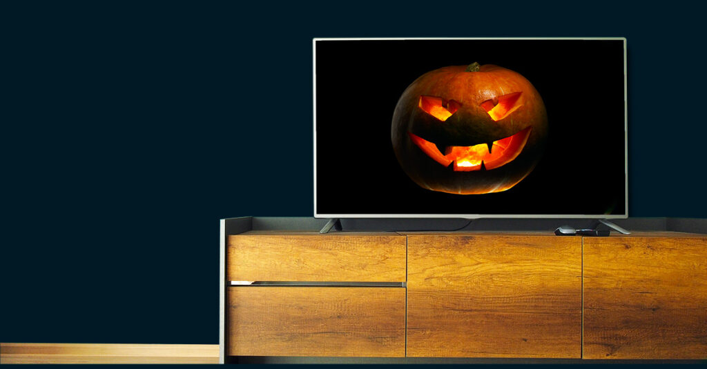 A scary pumpkin on a TV