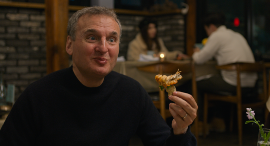 Phil eating in restaurant